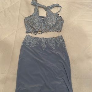 Beautiful two piece from Faviana. Light blue, in good condition.